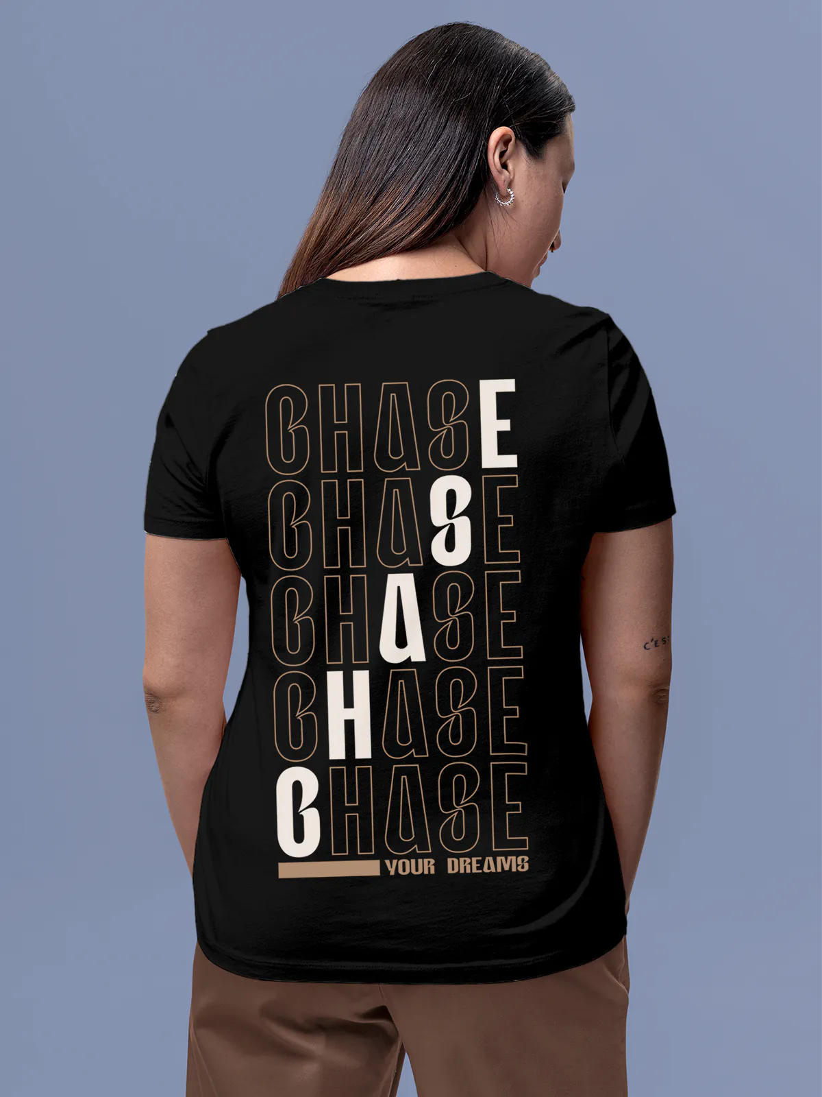 Model wearing Women's Black Round Neck T-shirt with 'Chase Your Dreams' design, offering effortless style and premium comfort