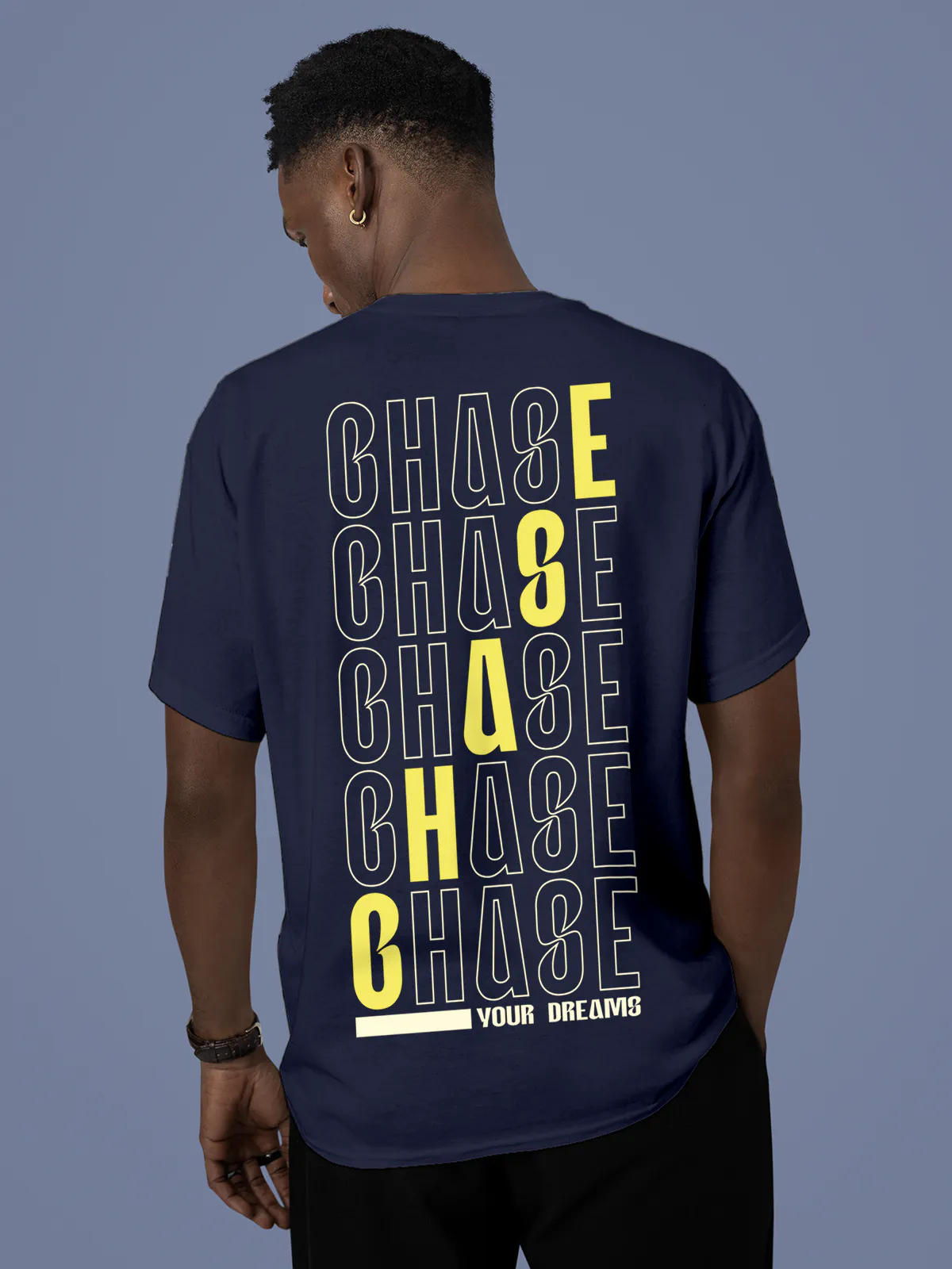 Model wearing Men's Navy Blue Round Neck T-shirt with 'Chase Your Dreams' design, offering effortless style and premium comfort
