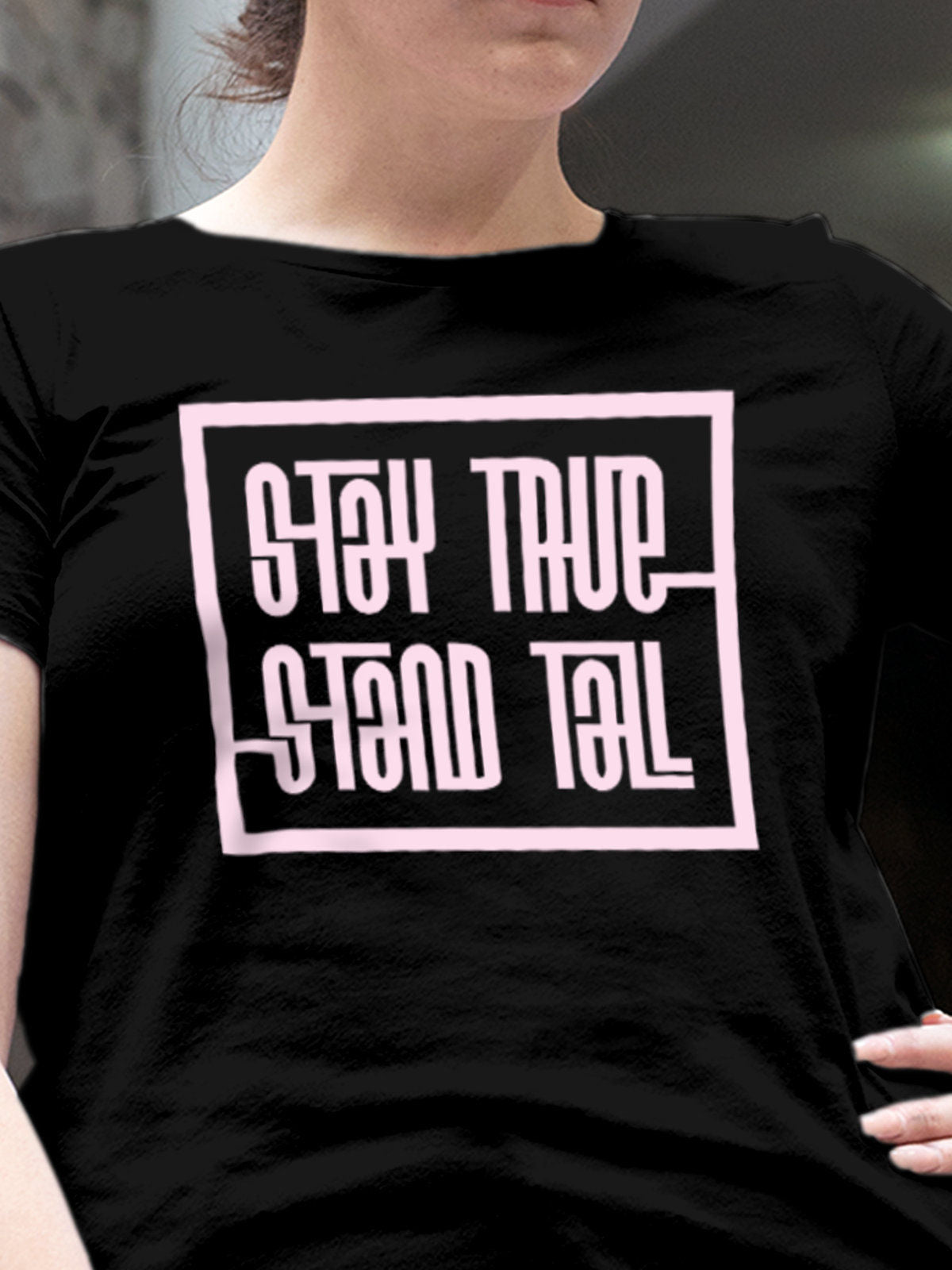 Close up of 'Stay True Stand Tall' design on Women's Black Round Neck T-shirt, highlighting intricate details and vibrant print.