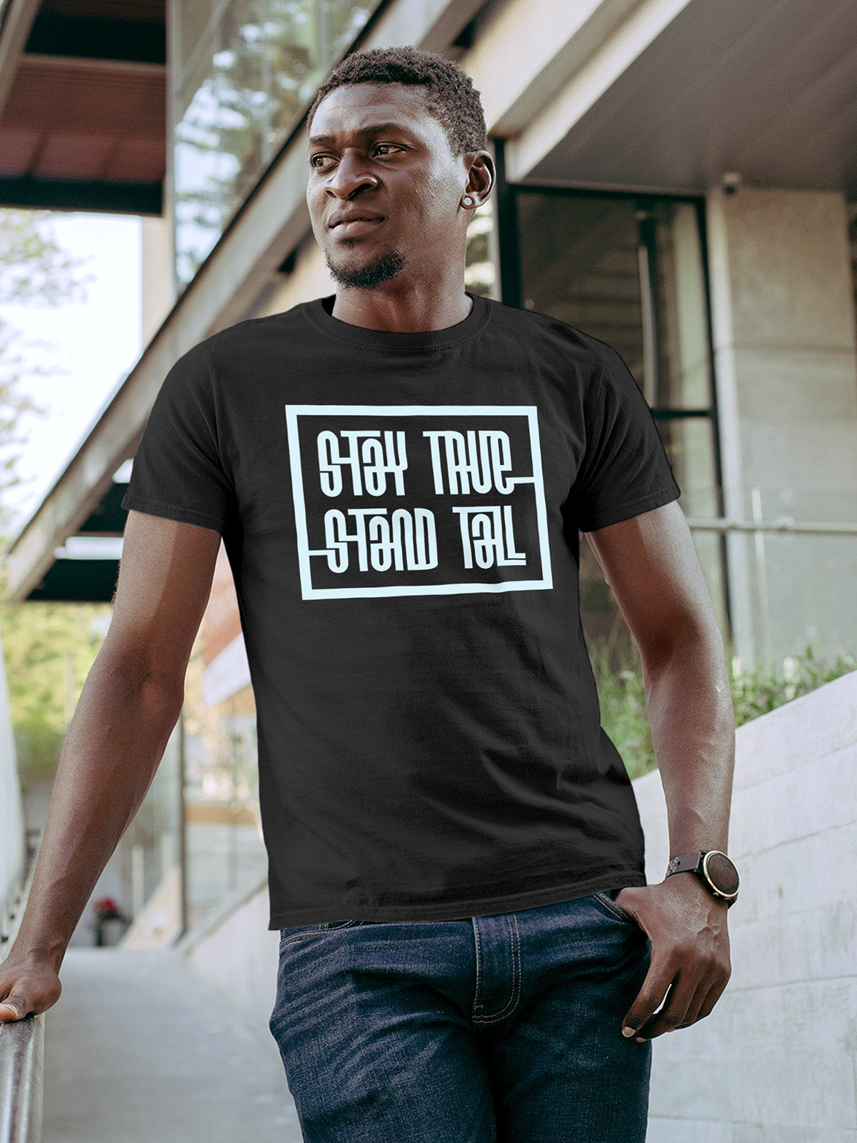 Model wearing Men's Dark Grey Round Neck T-shirt with 'Stay True Stand Tall' design, offering effortless style and premium comfort