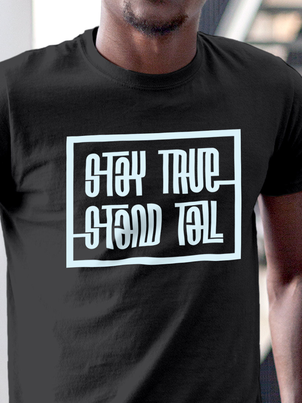 Close up of 'Stay True Stand Tall' design on Men's Dark Grey Round Neck T-shirt, highlighting intricate details and vibrant print.