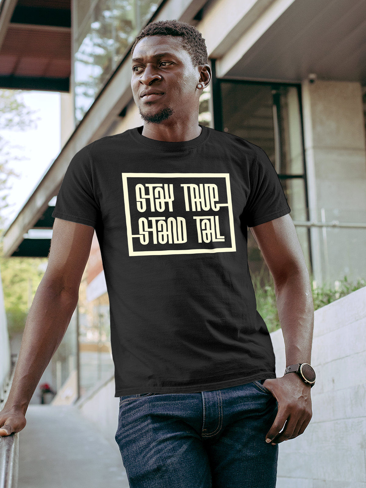 Model wearing Men's Dark Grey Round Neck T-shirt with 'Stay True Stand Tall' design, offering effortless style and premium comfort