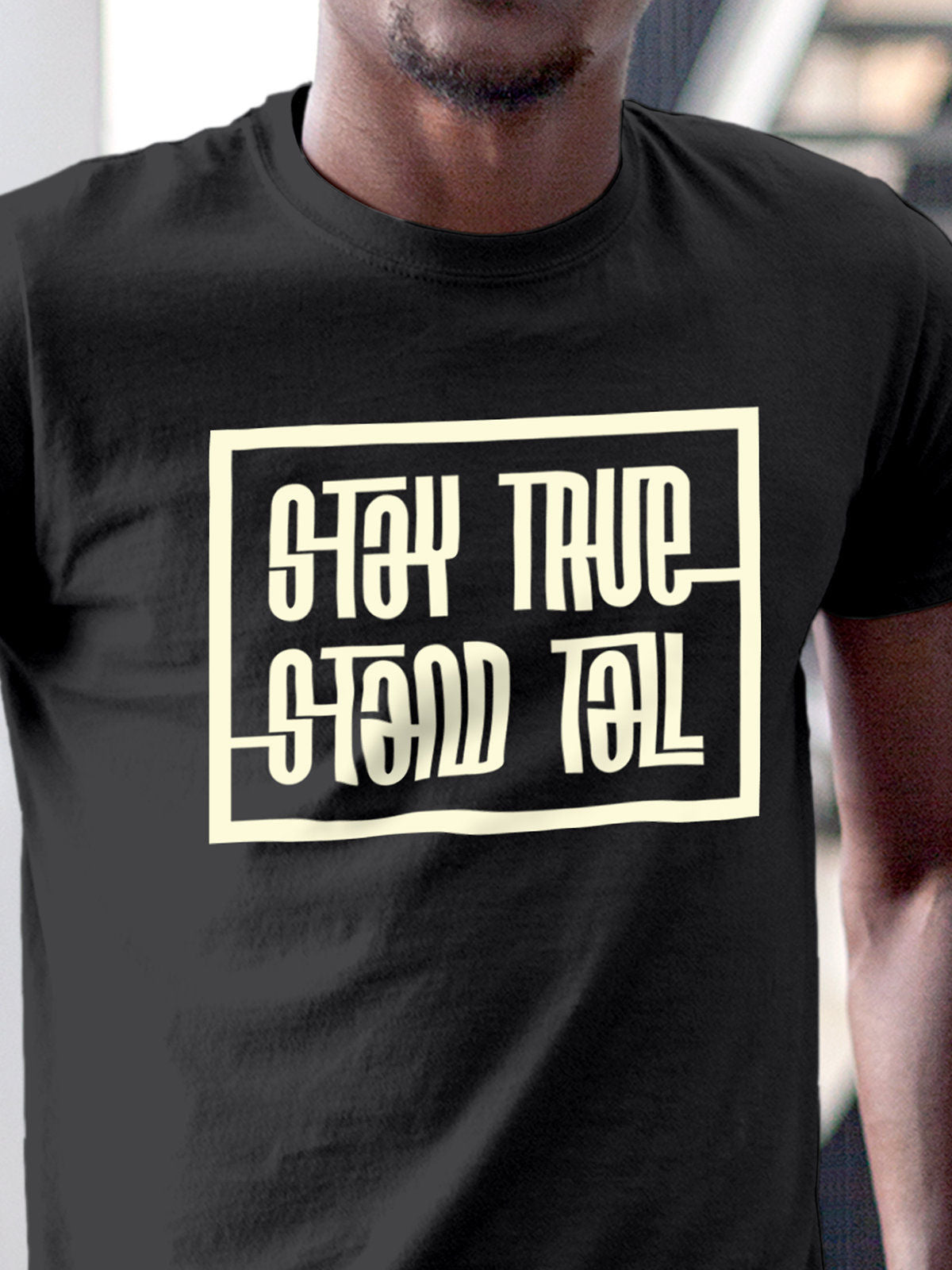 Close up of 'Stay True Stand Tall' design on Men's Dark Grey Round Neck T-shirt, highlighting intricate details and vibrant print.