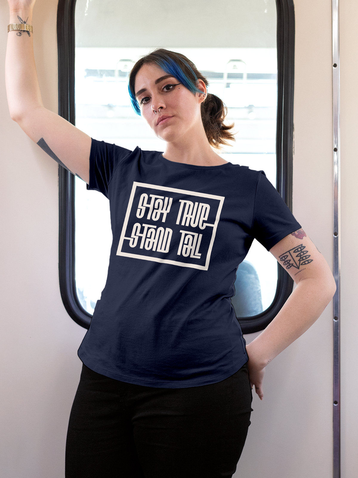 Model wearing Women's Navy Blue Round Neck T-shirt with 'Stay True Stand Tall' design, offering effortless style and premium comfort