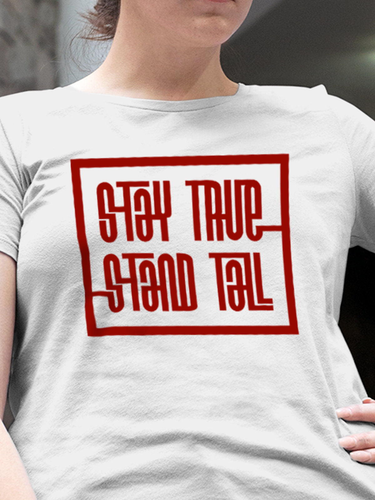 Close up of 'Stay True Stand Tall' design on Women's White Round Neck T-shirt, highlighting intricate details and vibrant print.