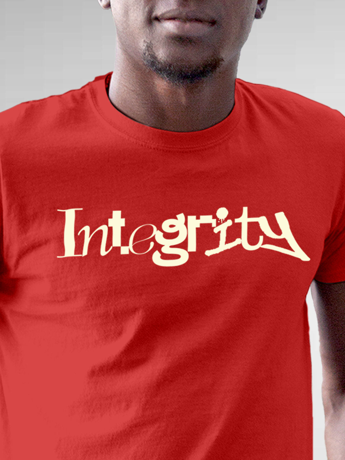 Close up of 'Integrity' design on Men's Red Round Neck T-shirt, highlighting intricate details and vibrant print.