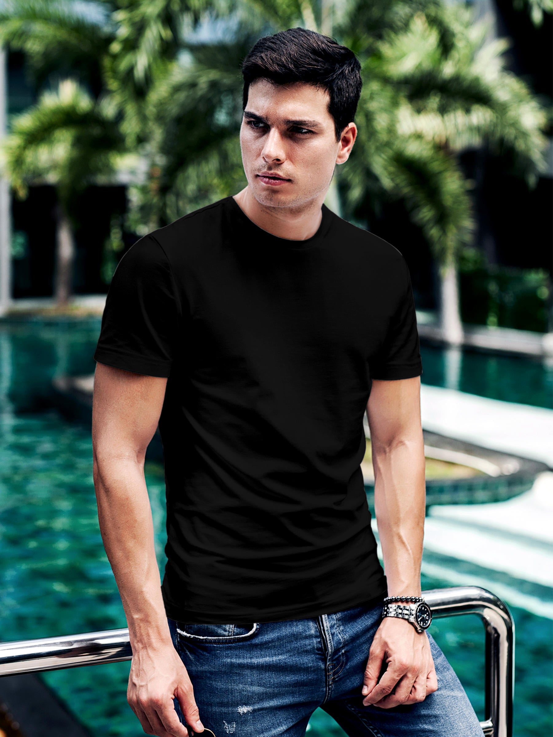 Model wearing Men's Black Round Neck Plain Solid T-shirt, offering effortless style and premium comfort