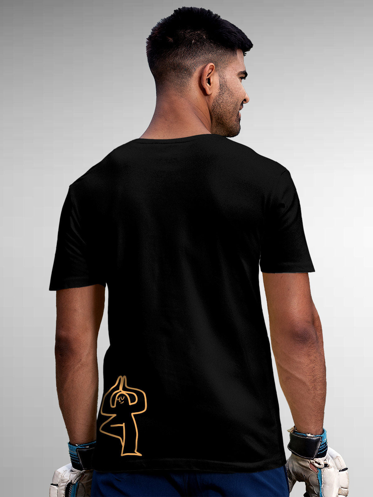 Model wearing Men's Black Round Neck T-shirt with 'Balance Is A Decision' design, offering effortless style and premium comfort