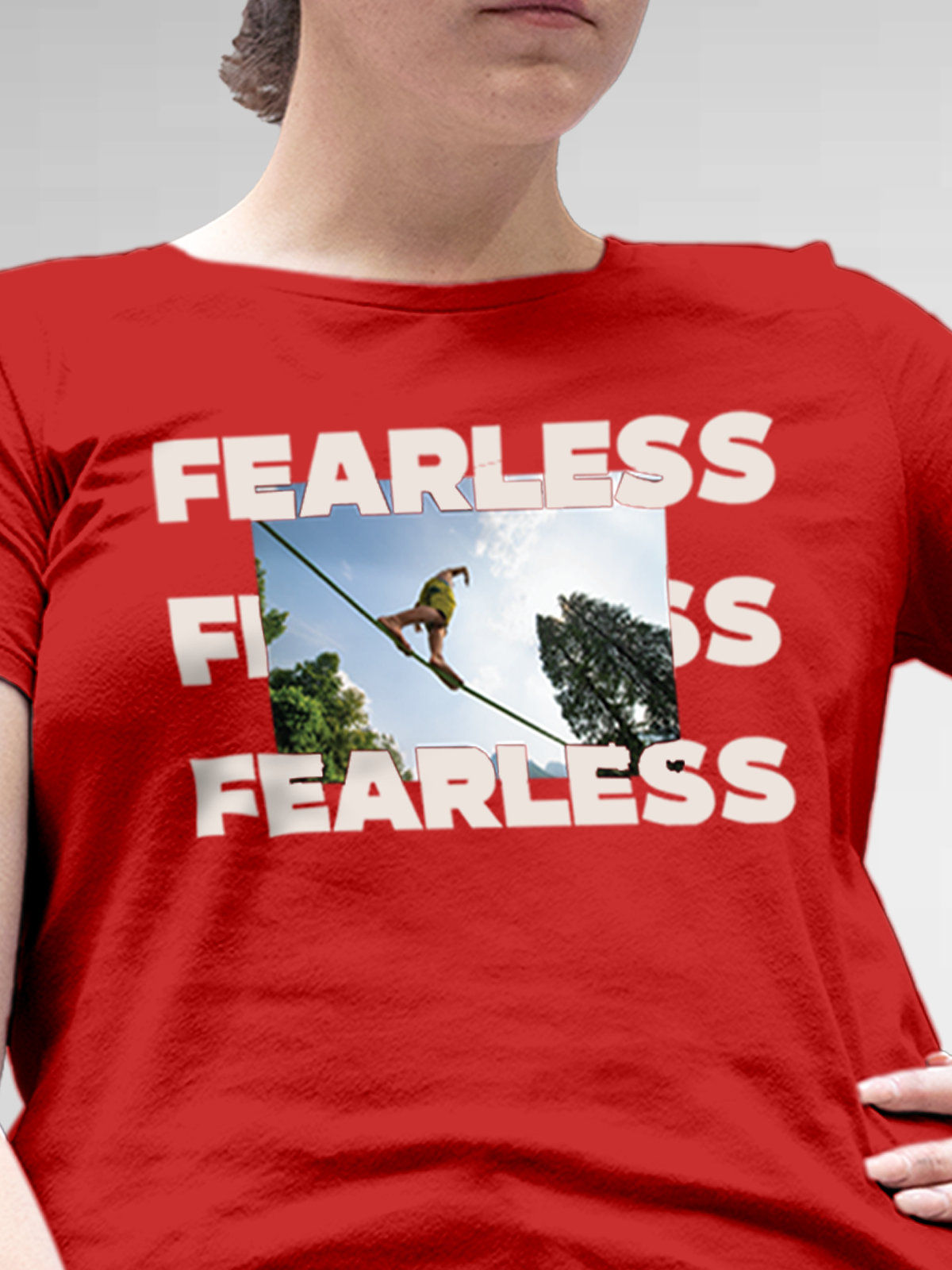 Close up of 'Fearless' design on Women's Red Round Neck T-shirt, highlighting intricate details and vibrant print.