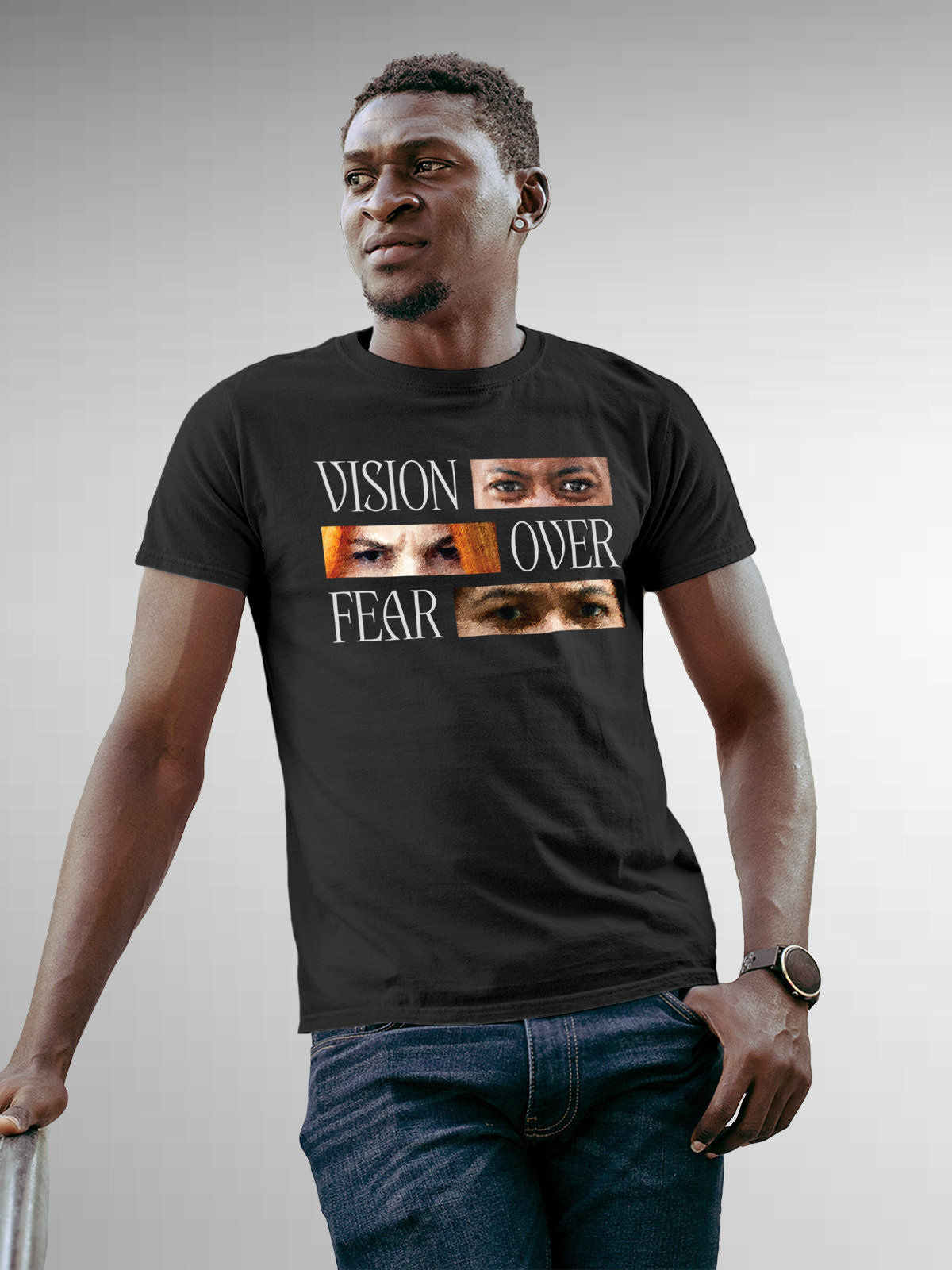 Model wearing Men's Dark Grey Round Neck T-shirt with 'Vision Over Fear' design, offering effortless style and premium comfort