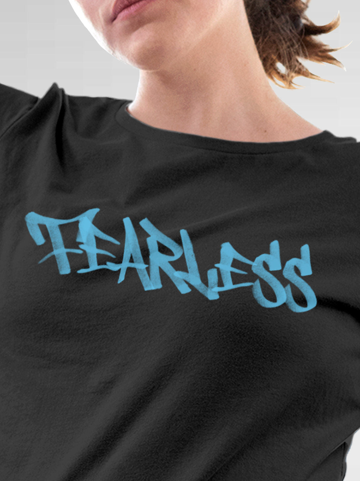 Close up of 'Fearless' design on Women's Dark Grey Round Neck T-shirt, highlighting intricate details and vibrant print.