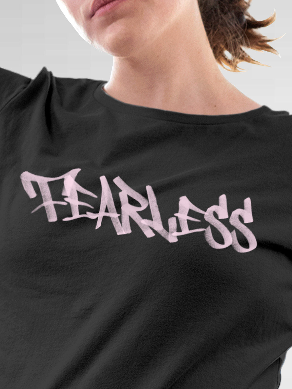 Close up of 'Fearless' design on Women's Dark Grey Round Neck T-shirt, highlighting intricate details and vibrant print.