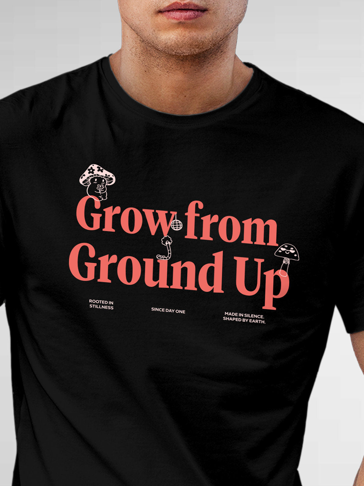 Close up of 'Grow From Ground Up' design on Men's Black Round Neck T-shirt, highlighting intricate details and vibrant print.