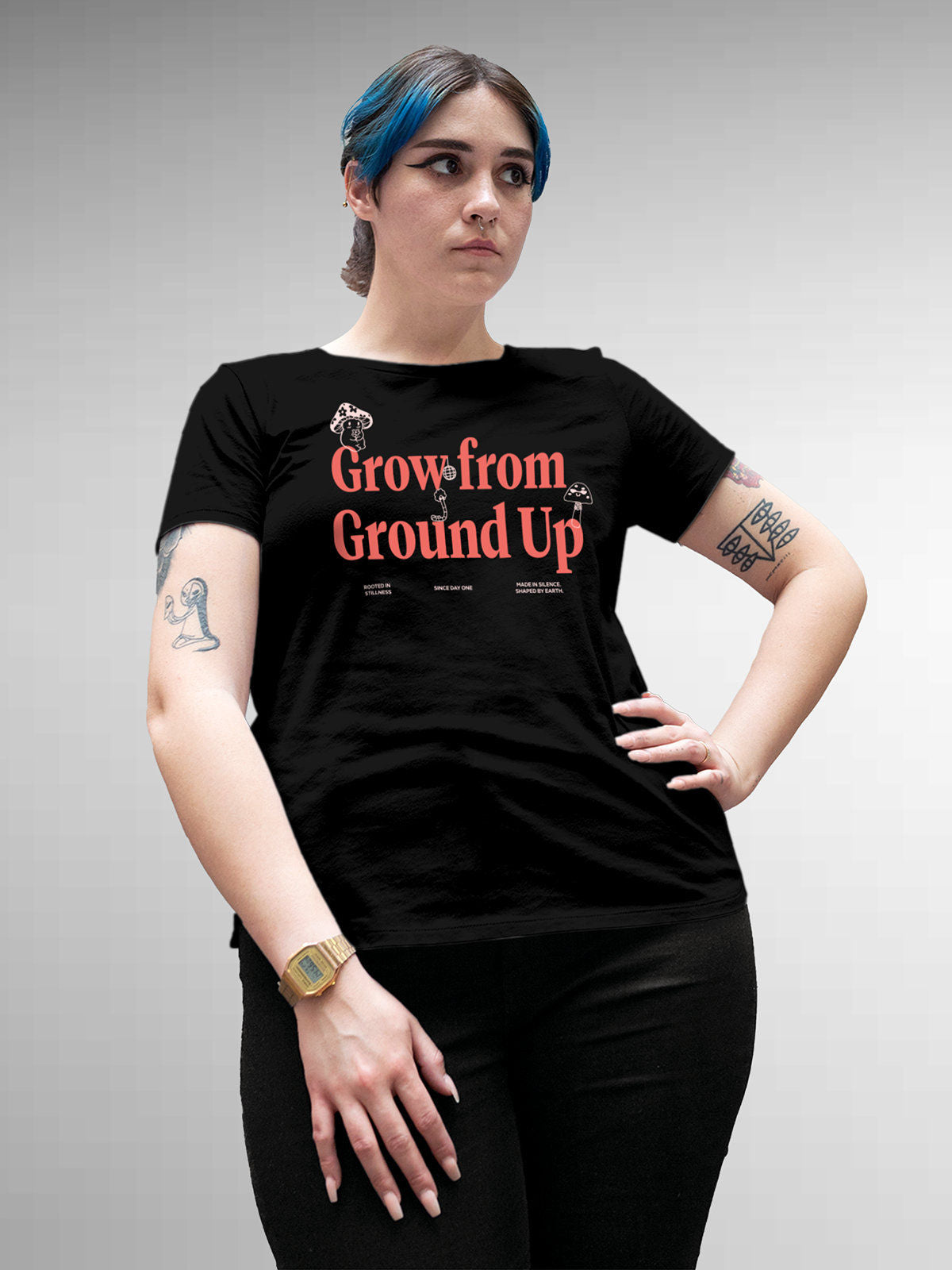 Model wearing Women's Black Round Neck T-shirt with 'Grow From Ground Up' design, offering effortless style and premium comfort
