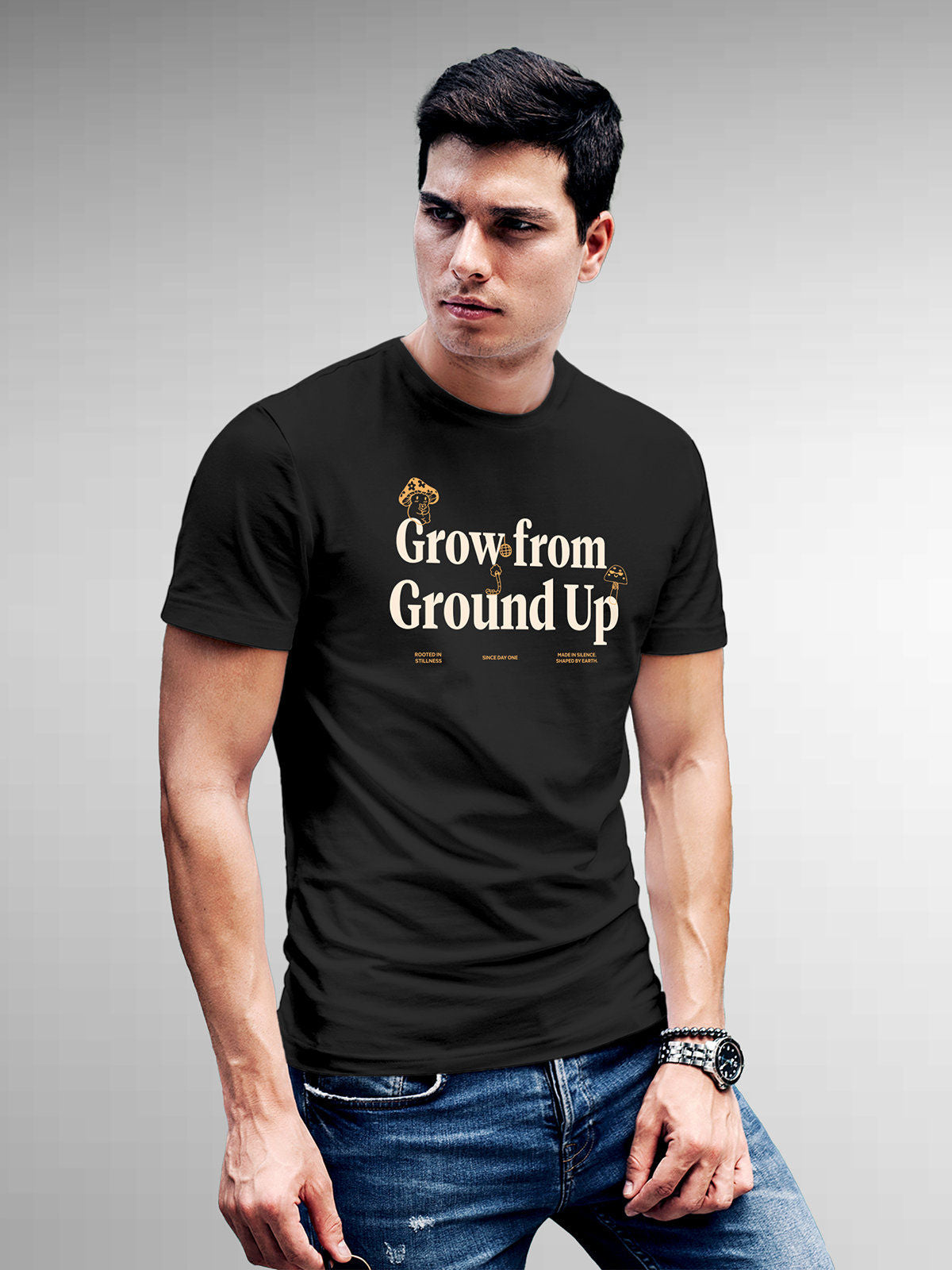 Model wearing Men's Dark Grey Round Neck T-shirt with 'Grow From Ground Up' design, offering effortless style and premium comfort