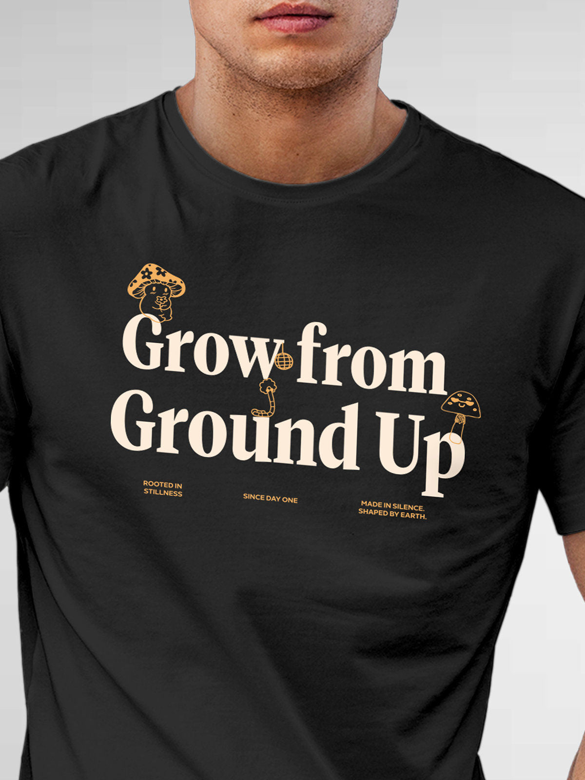 Close up of 'Grow From Ground Up' design on Men's Dark Grey Round Neck T-shirt, highlighting intricate details and vibrant print.