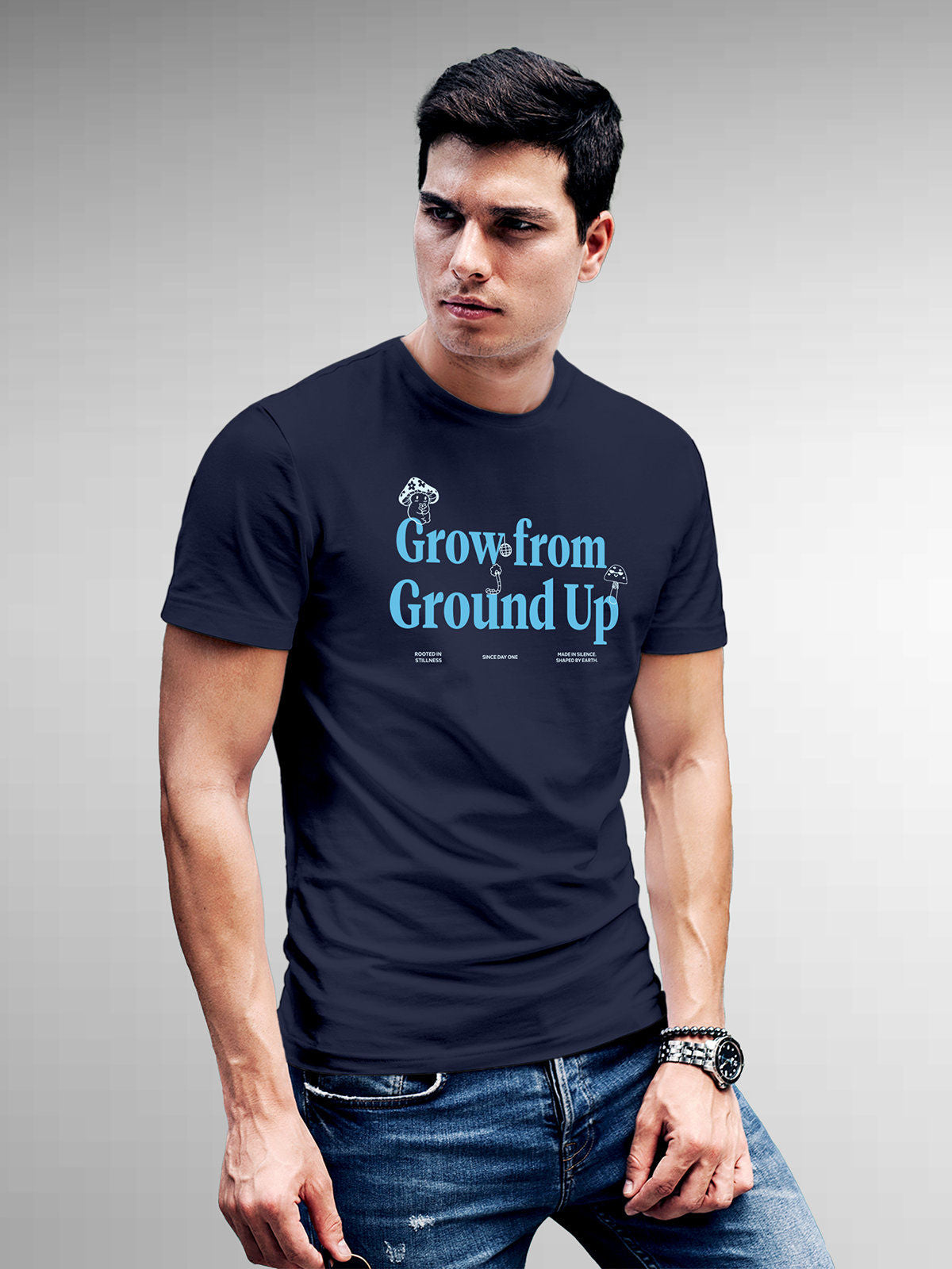 Model wearing Men's Navy Blue Round Neck T-shirt with 'Grow From Ground Up' design, offering effortless style and premium comfort