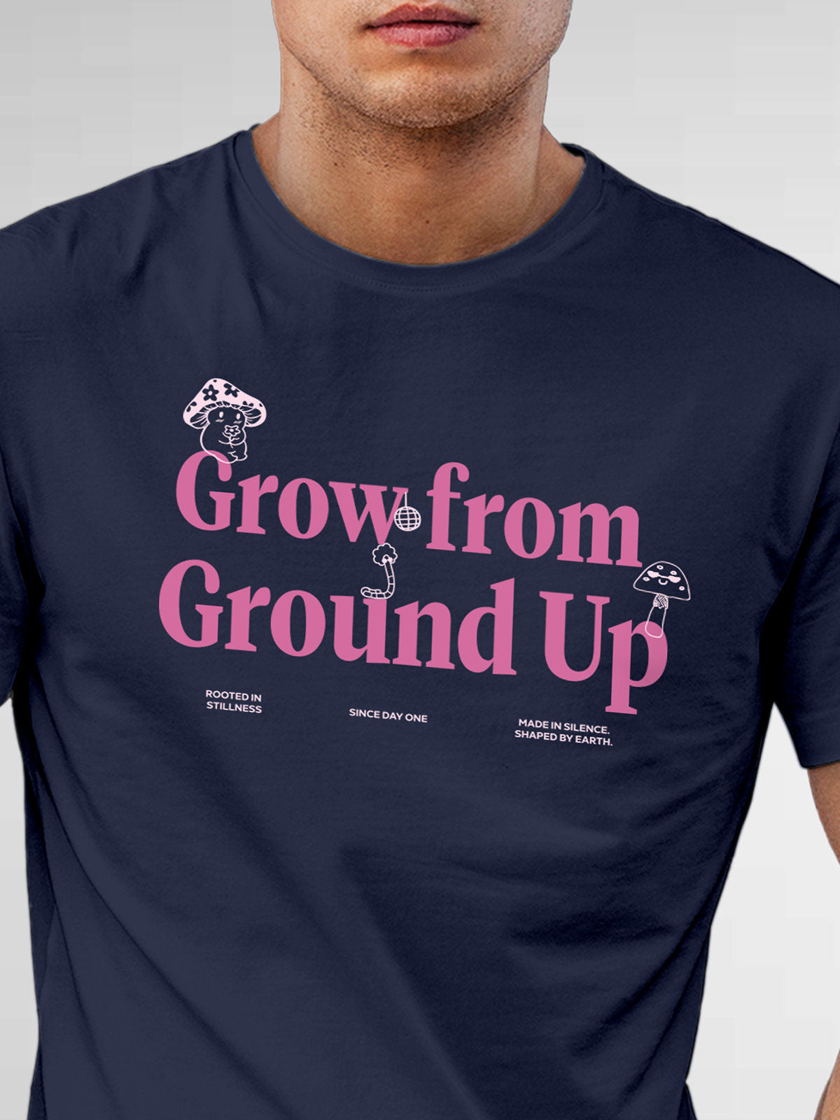 Close up of 'Grow From Ground Up' design on Men's Navy Blue Round Neck T-shirt, highlighting intricate details and vibrant print.