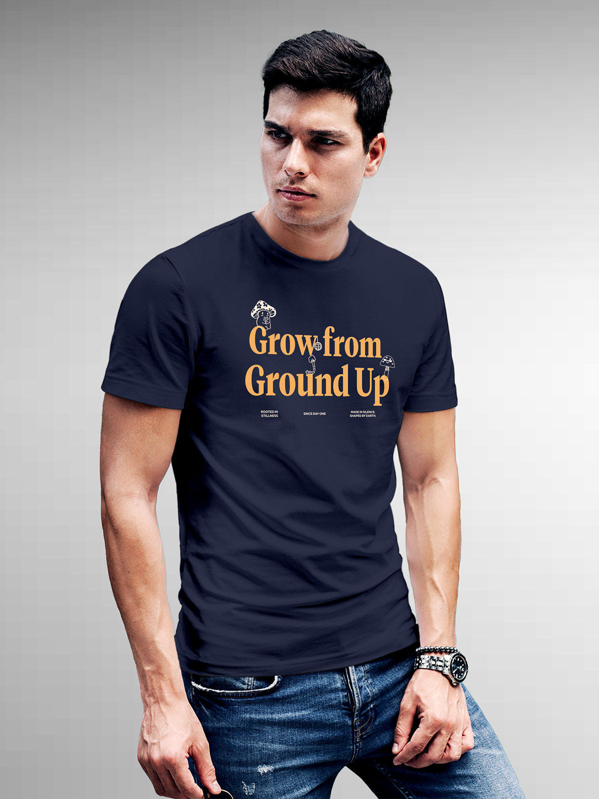 Model wearing Men's Navy Blue Round Neck T-shirt with 'Grow From Ground Up' design, offering effortless style and premium comfort