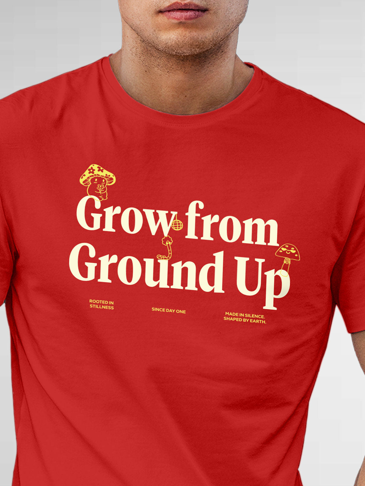 Close up of 'Grow From Ground Up' design on Men's Red Round Neck T-shirt, highlighting intricate details and vibrant print.