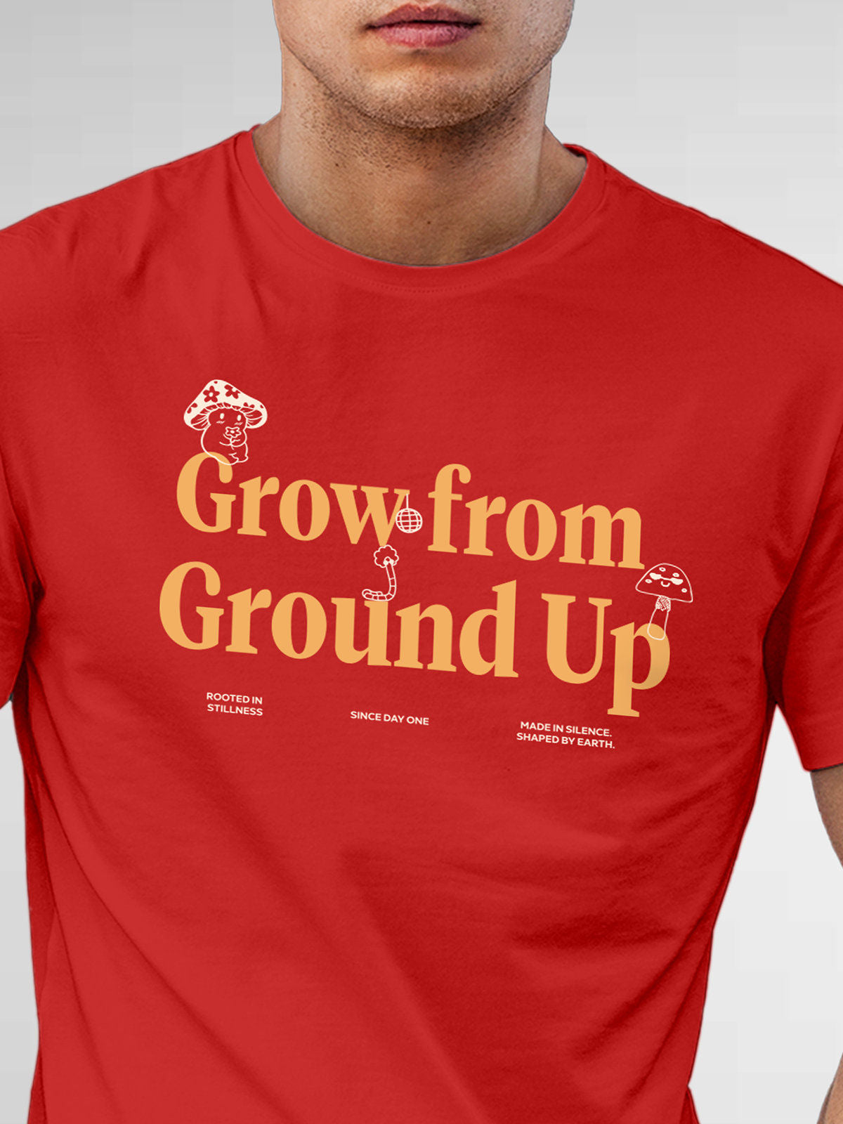 Close up of 'Grow From Ground Up' design on Men's Red Round Neck T-shirt, highlighting intricate details and vibrant print.