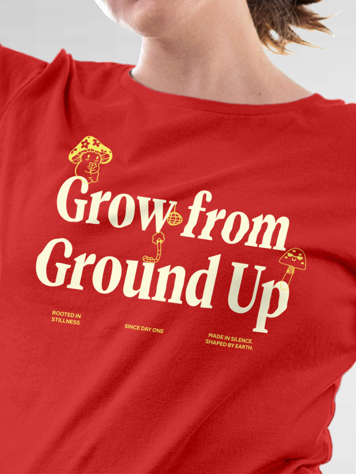Close up of 'Grow From Ground Up' design on Women's Red Round Neck T-shirt, highlighting intricate details and vibrant print.
