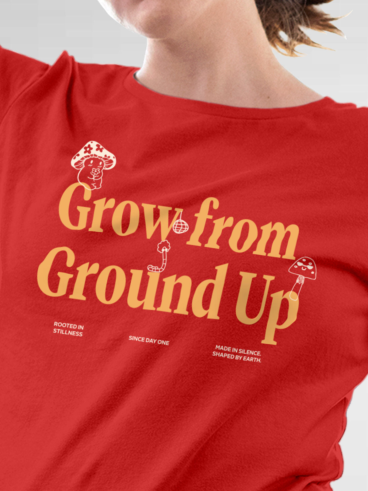Close up of 'Grow From Ground Up' design on Women's Red Round Neck T-shirt, highlighting intricate details and vibrant print.