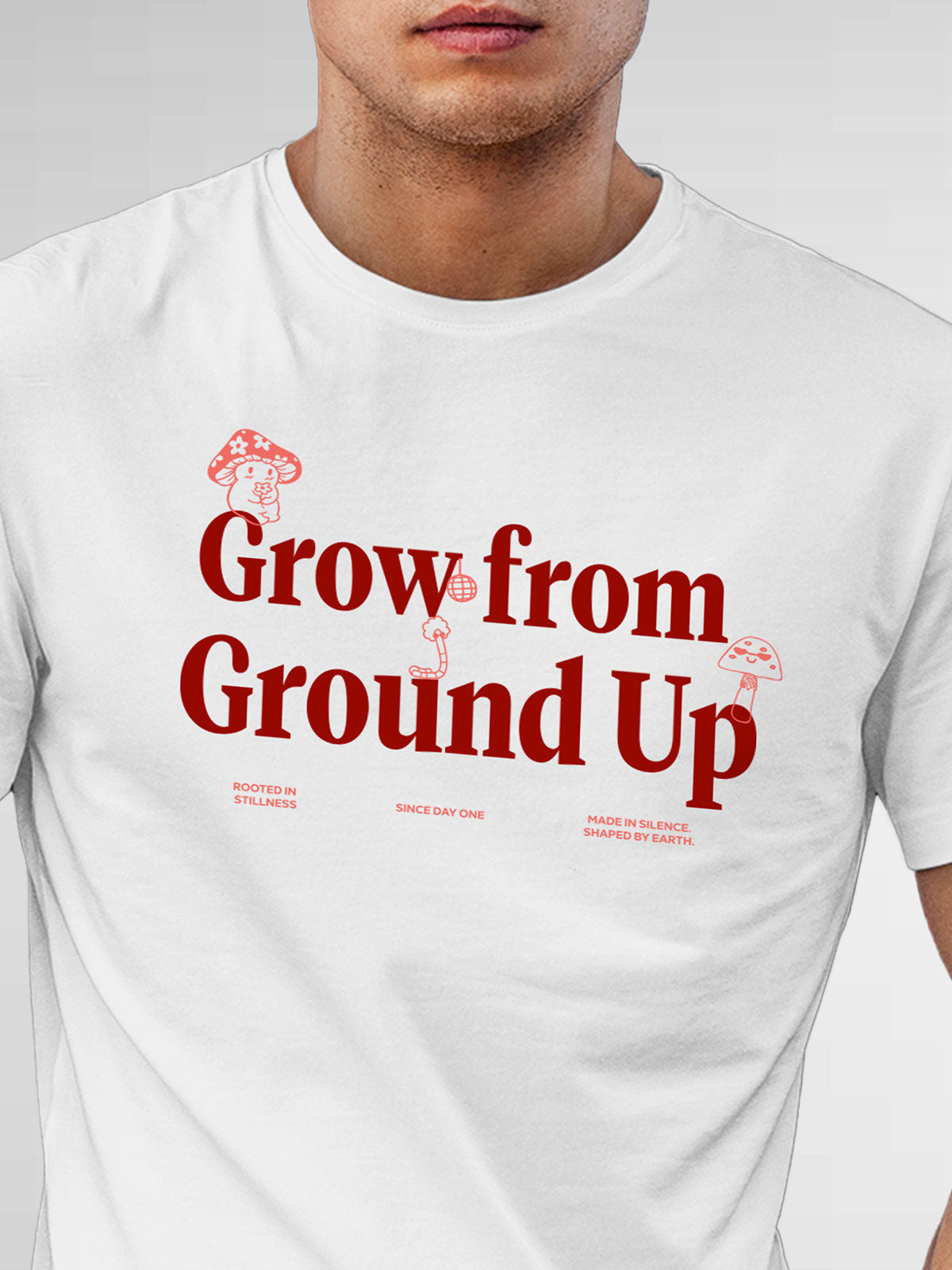 Close up of 'Grow From Ground Up' design on Men's White Round Neck T-shirt, highlighting intricate details and vibrant print.