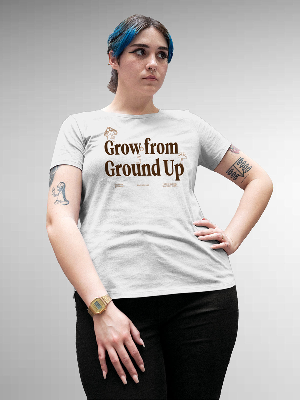 Model wearing Women's White Round Neck T-shirt with 'Grow From Ground Up' design, offering effortless style and premium comfort