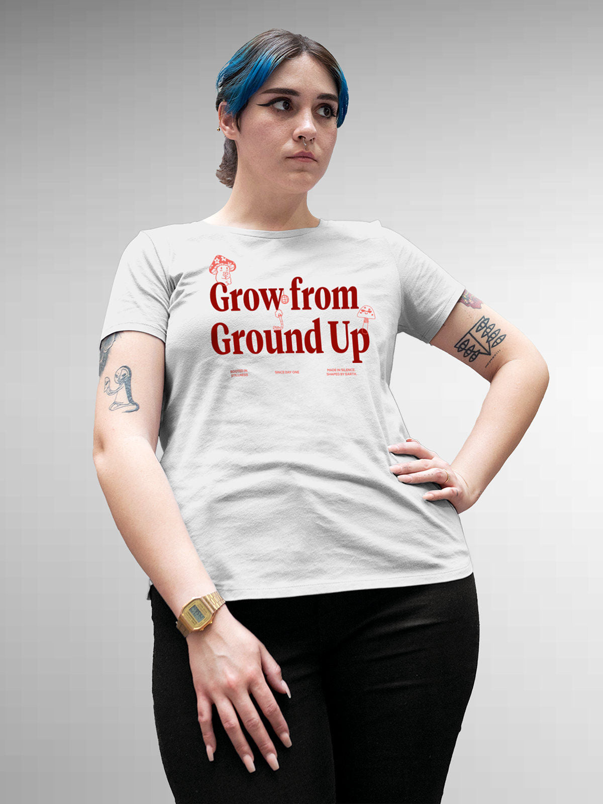 Model wearing Women's White Round Neck T-shirt with 'Grow From Ground Up' design, offering effortless style and premium comfort