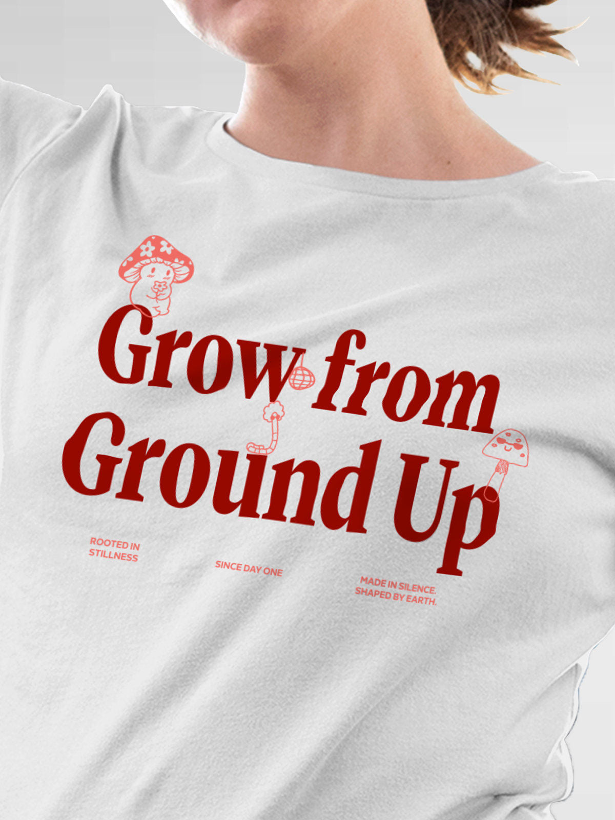 Close up of 'Grow From Ground Up' design on Women's White Round Neck T-shirt, highlighting intricate details and vibrant print.