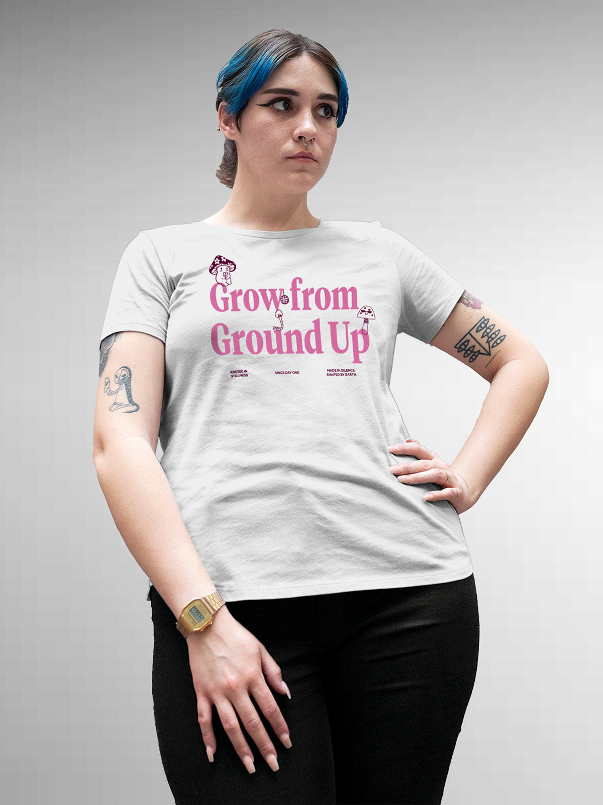 Model wearing Women's White Round Neck T-shirt with 'Grow From Ground Up' design, offering effortless style and premium comfort