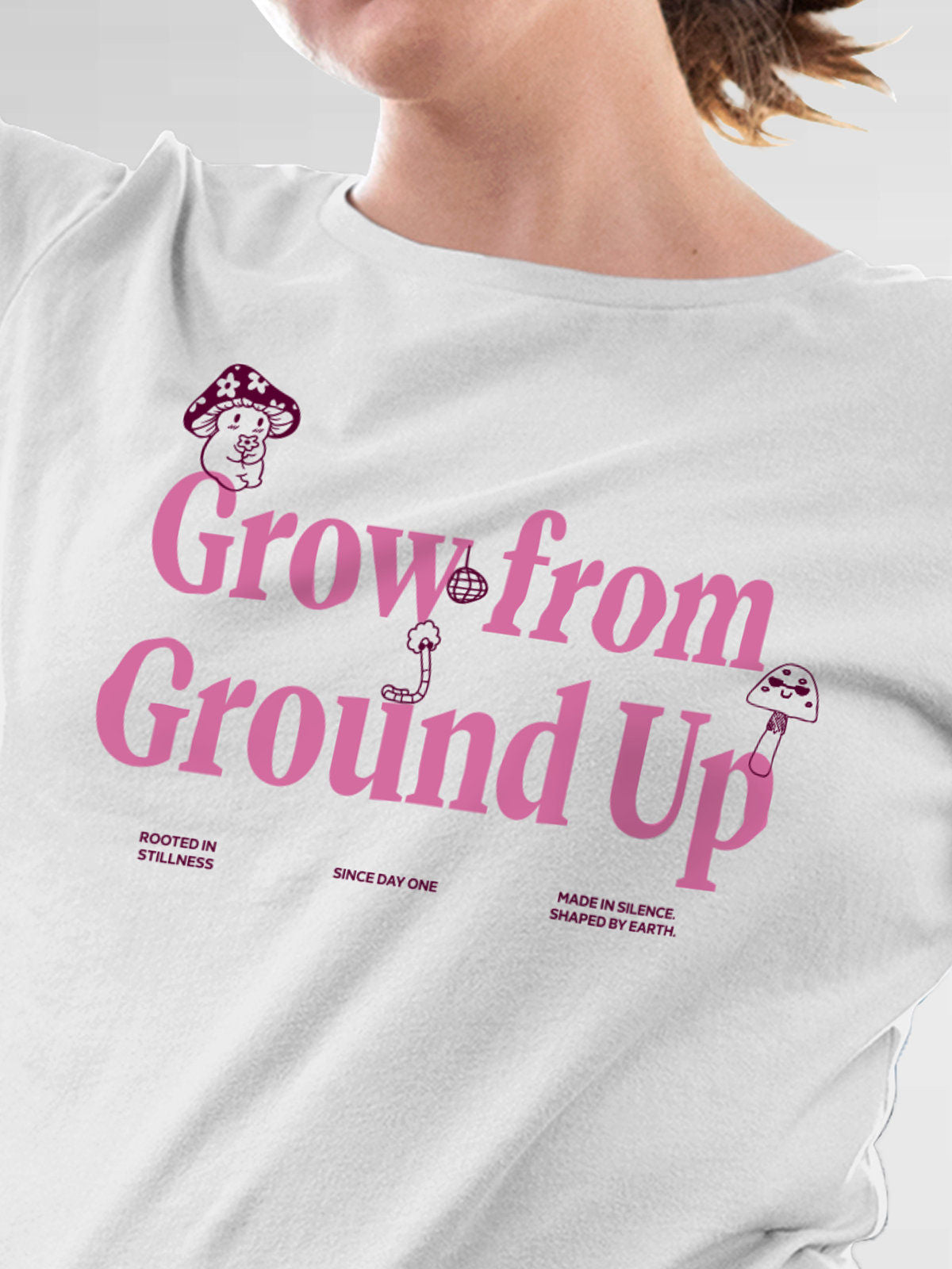 Close up of 'Grow From Ground Up' design on Women's White Round Neck T-shirt, highlighting intricate details and vibrant print.