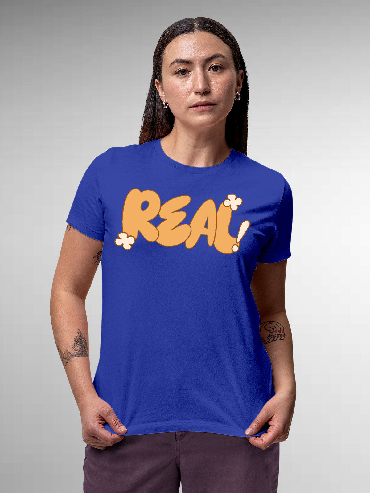 Model wearing Women's Blue Round Neck T-shirt with 'Real' design, offering effortless style and premium comfort