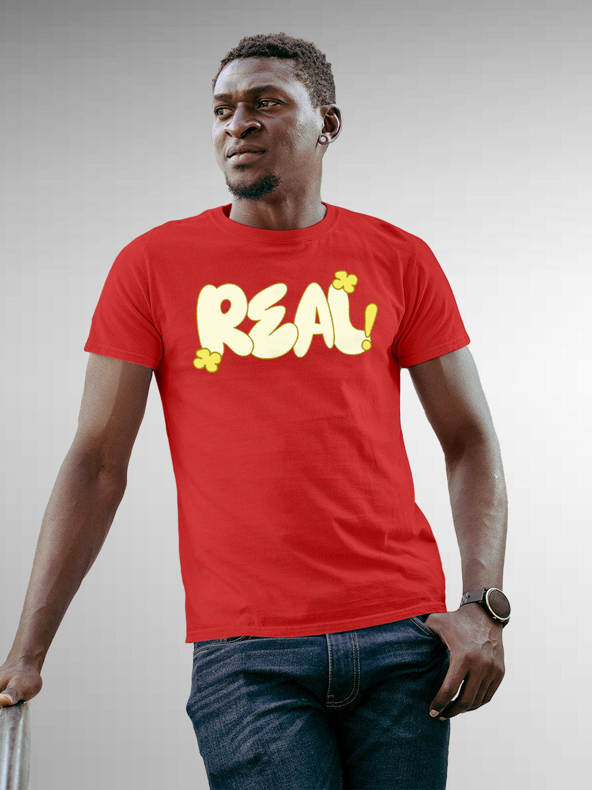 Model wearing Men's Red Round Neck T-shirt with 'Real' design, offering effortless style and premium comfort