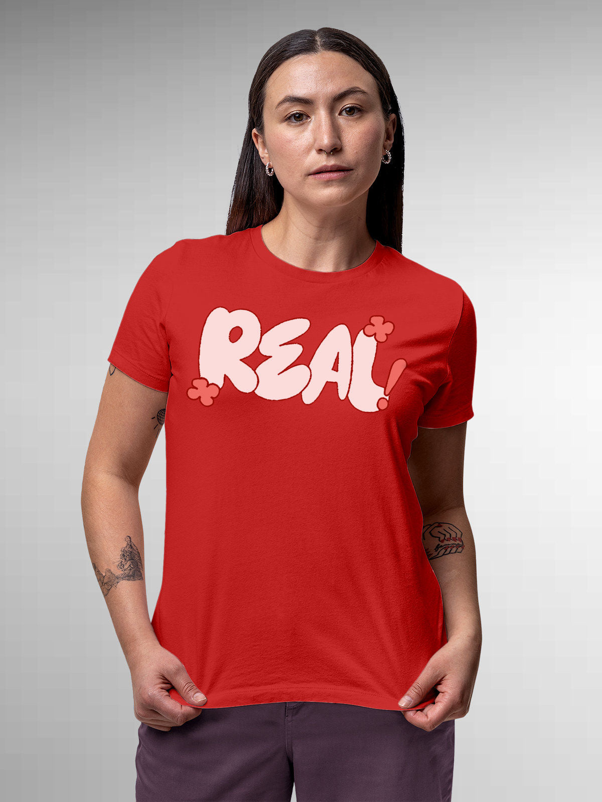 Model wearing Women's Red Round Neck T-shirt with 'Real' design, offering effortless style and premium comfort