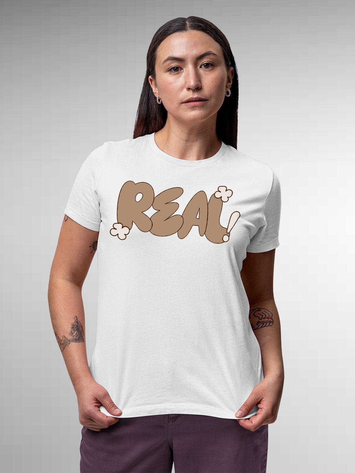 Model wearing Women's White Round Neck T-shirt with 'Real' design, offering effortless style and premium comfort