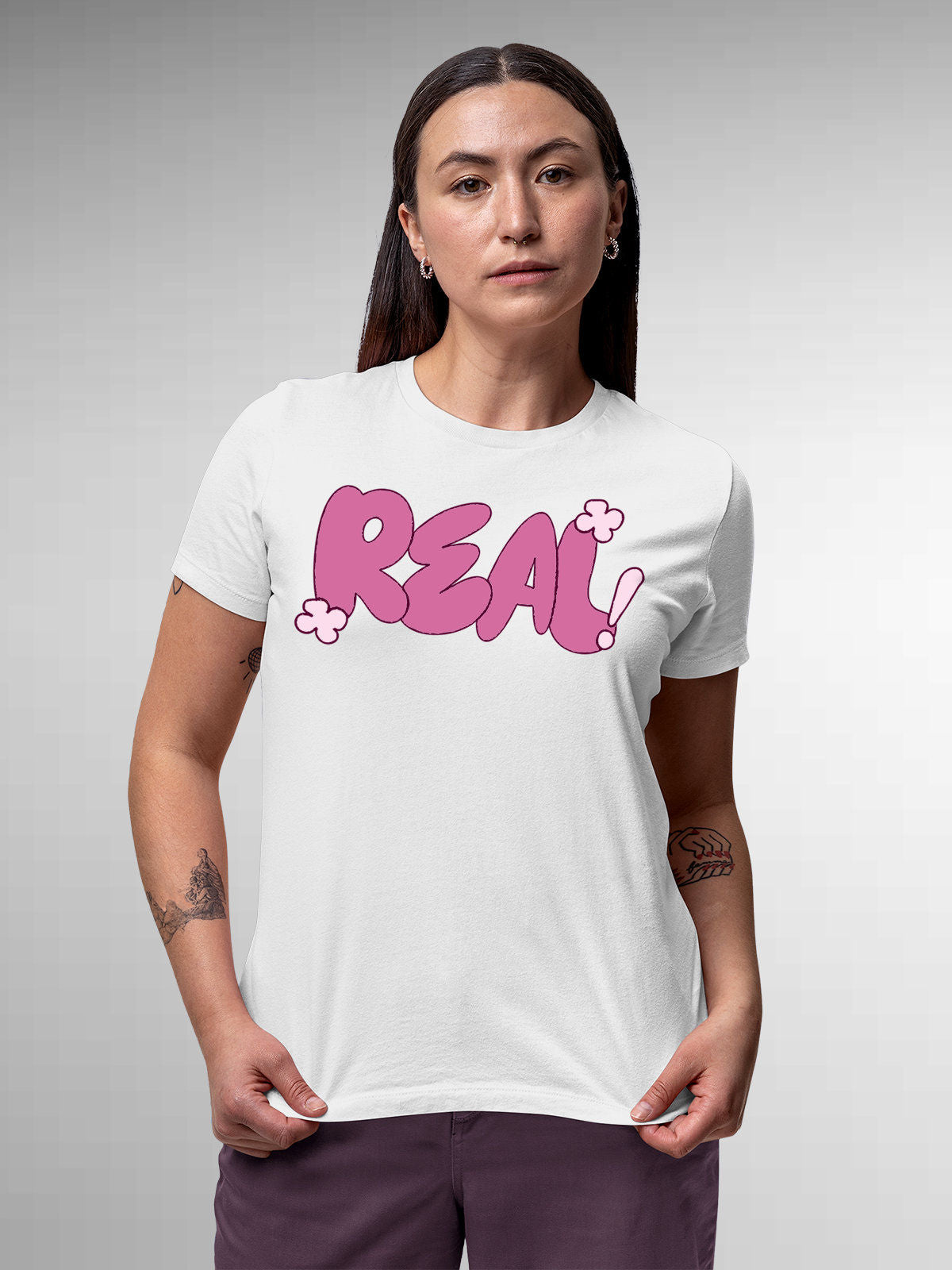 Model wearing Women's White Round Neck T-shirt with 'Real' design, offering effortless style and premium comfort