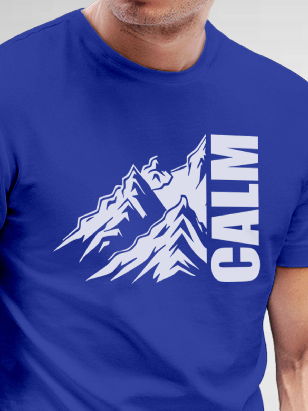 Close up of 'Calm' design on Men's Blue Round Neck T-shirt, highlighting intricate details and vibrant print.