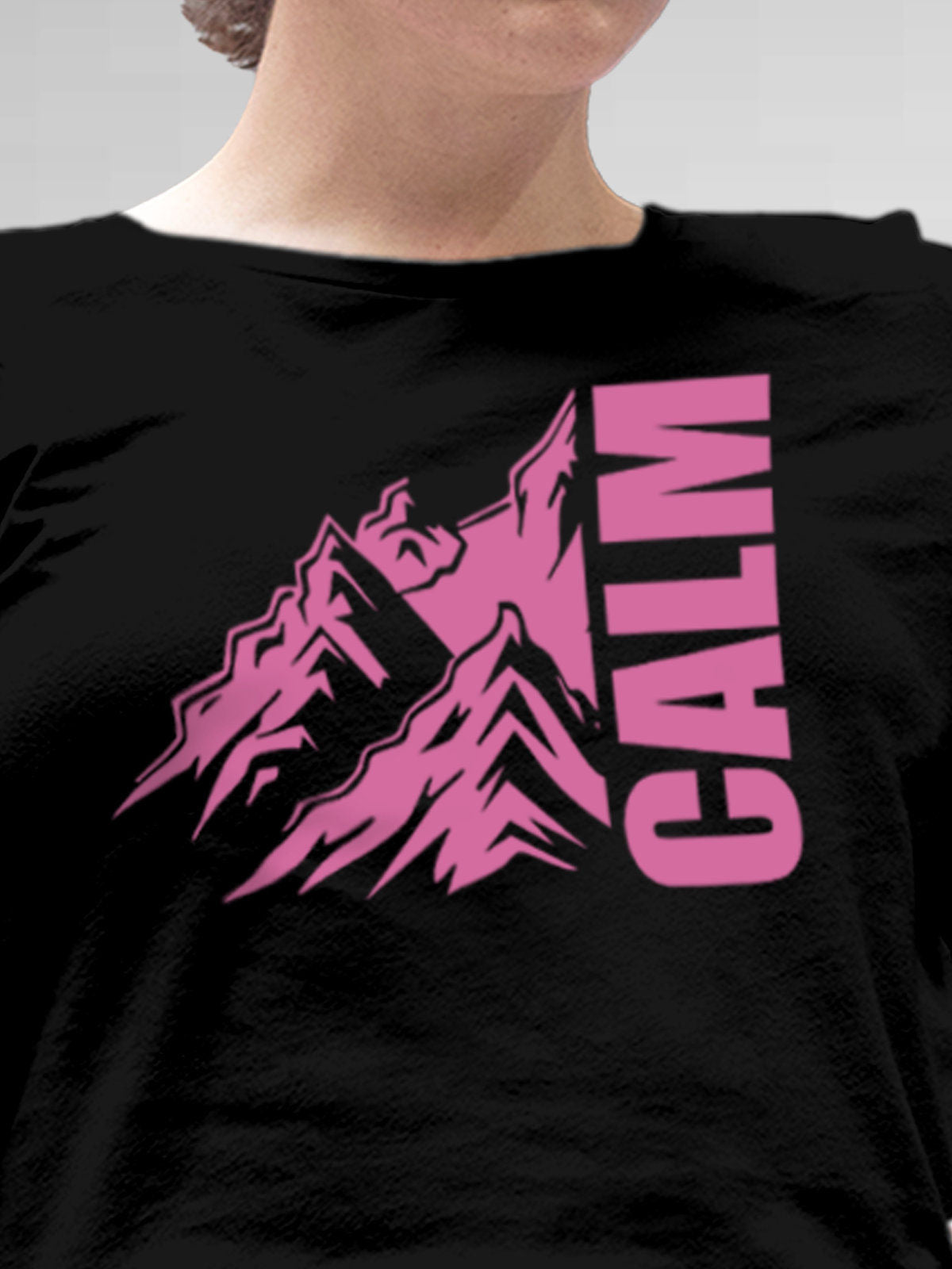 Close up of 'Calm' design on Women's Black Round Neck T-shirt, highlighting intricate details and vibrant print.