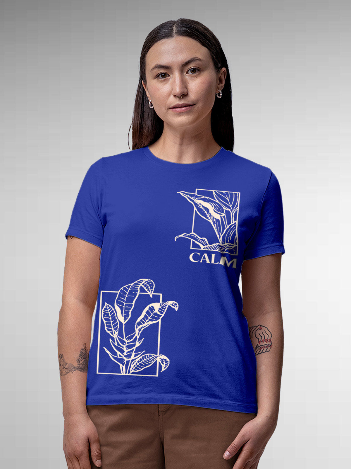 Model wearing Women's Blue Round Neck T-shirt with 'Calm' design, offering effortless style and premium comfort