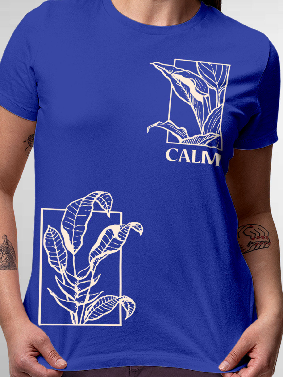 Close up of 'Calm' design on Women's Blue Round Neck T-shirt, highlighting intricate details and vibrant print.