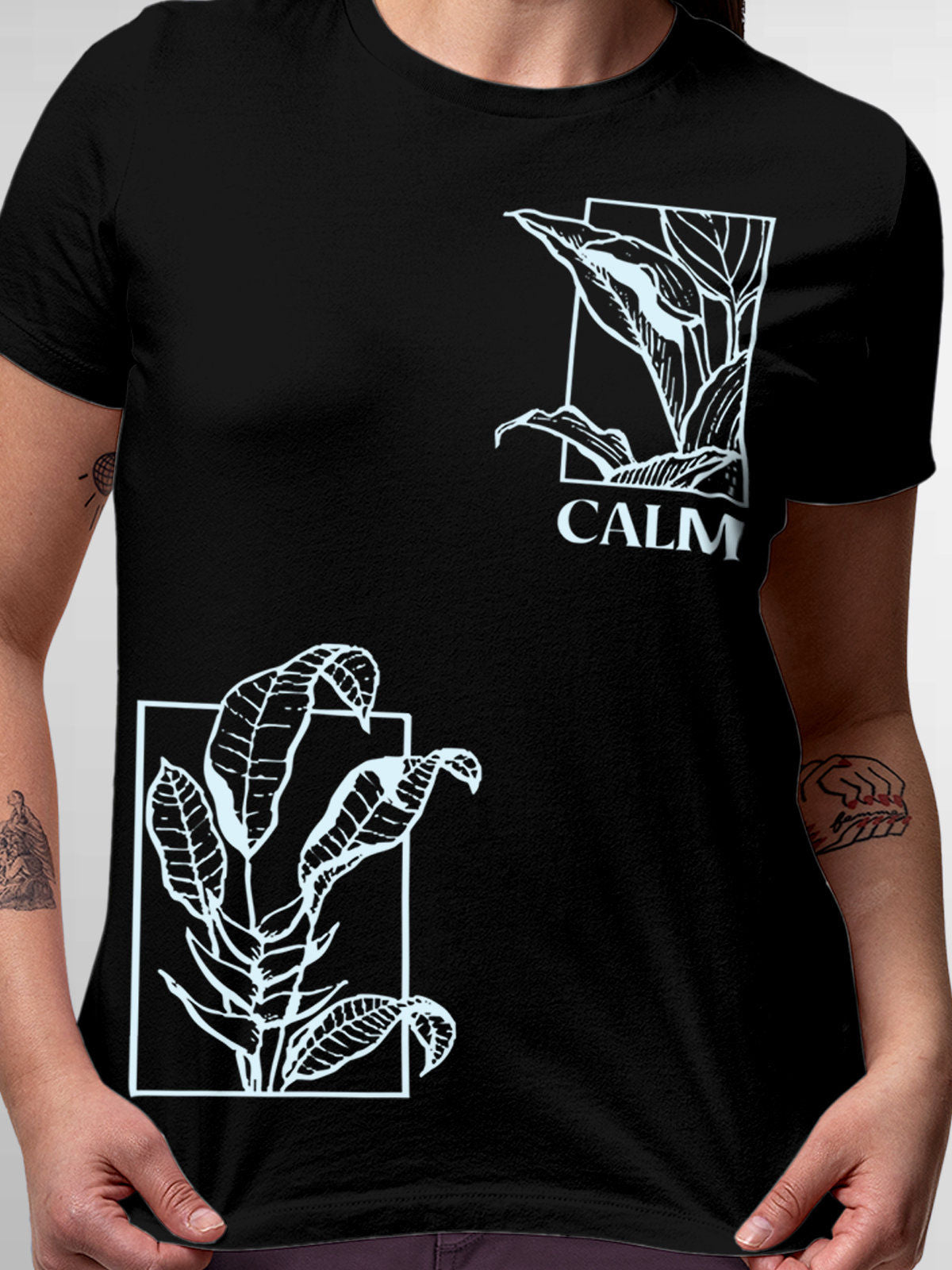 Close up of 'Calm' design on Women's Black Round Neck T-shirt, highlighting intricate details and vibrant print.