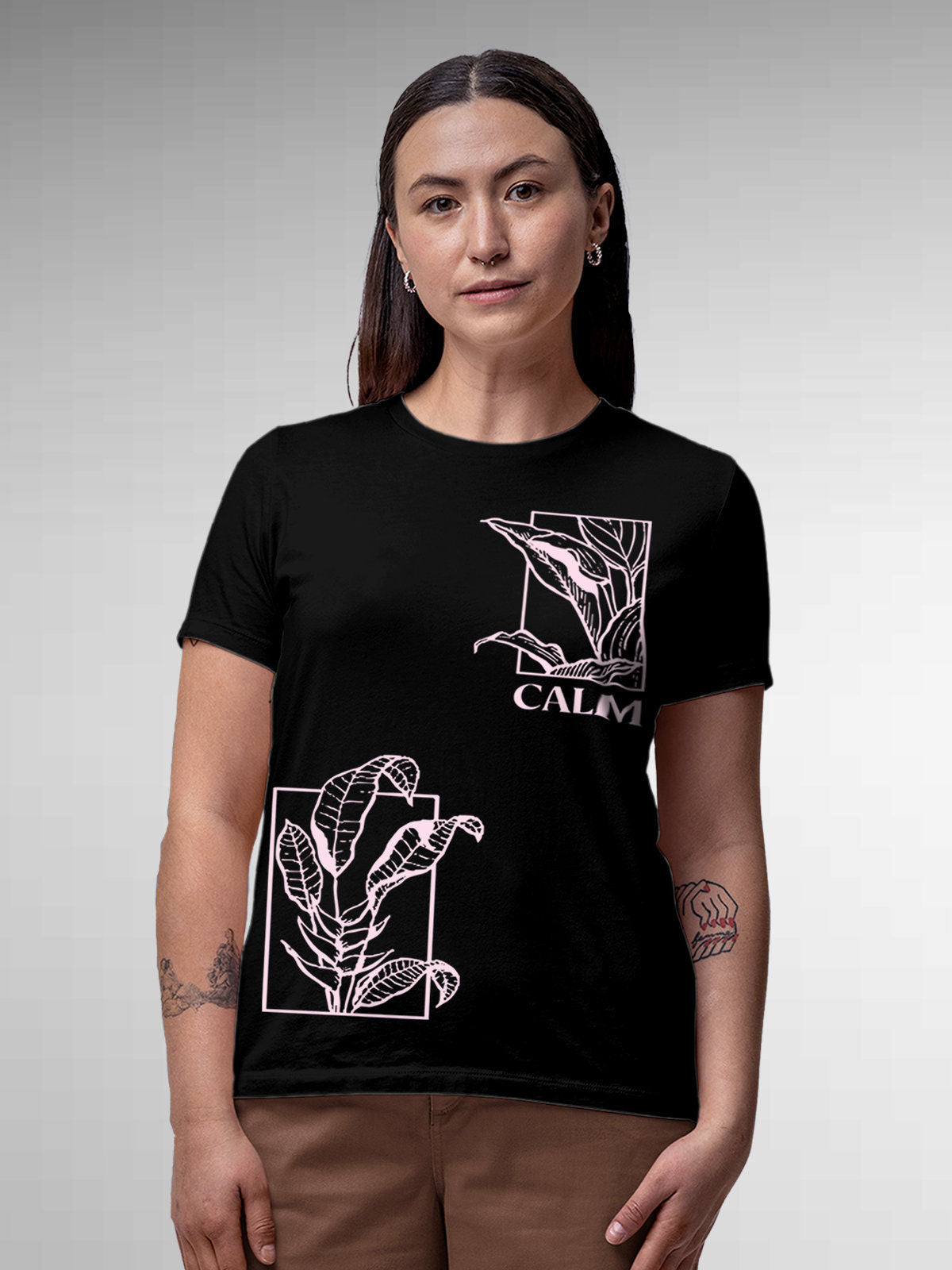 Model wearing Women's Black Round Neck T-shirt with 'Calm' design, offering effortless style and premium comfort