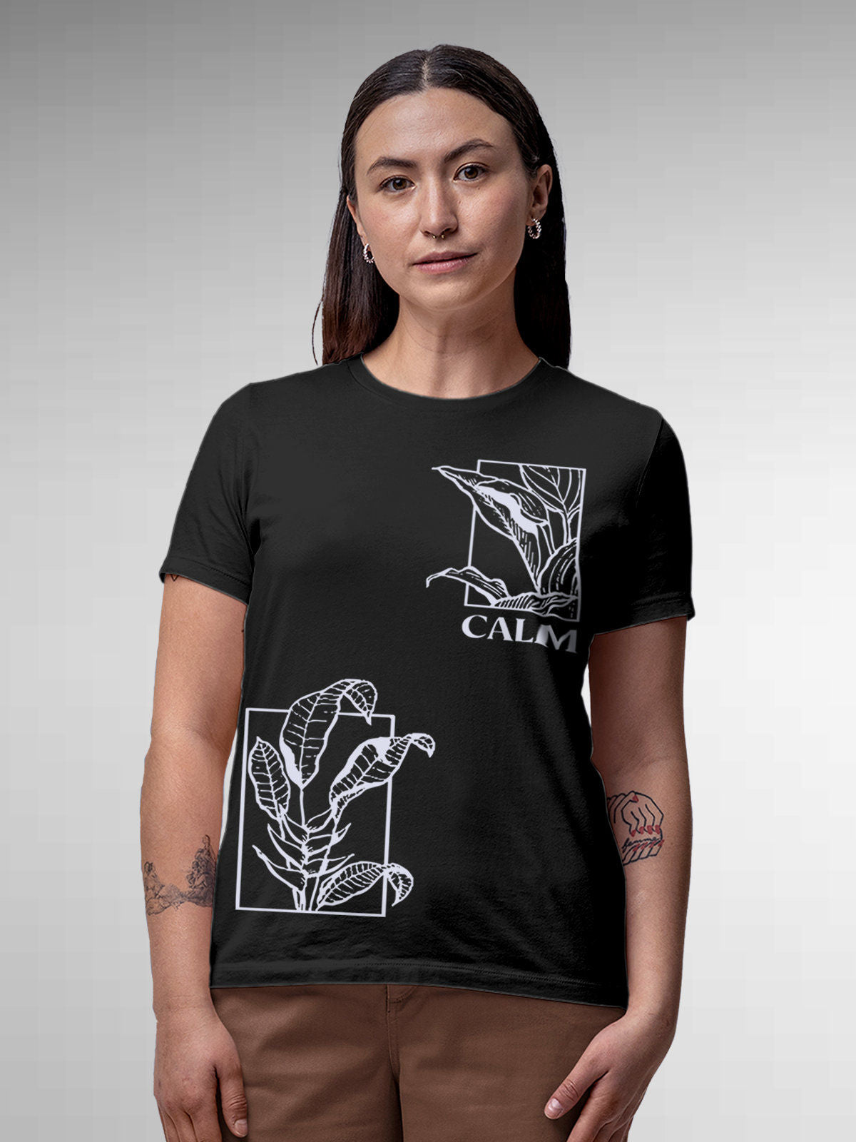 Model wearing Women's Dark Grey Round Neck T-shirt with 'Calm' design, offering effortless style and premium comfort