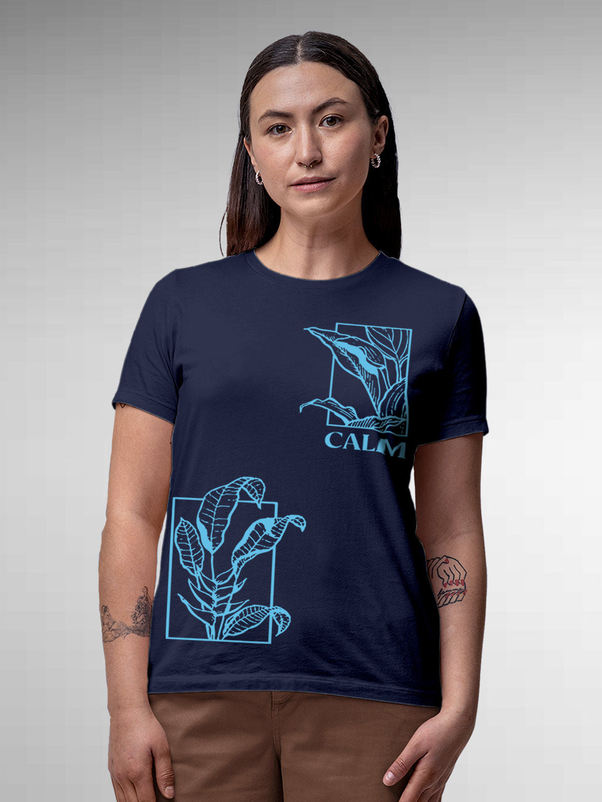 Model wearing Women's Navy Blue Round Neck T-shirt with 'Calm' design, offering effortless style and premium comfort