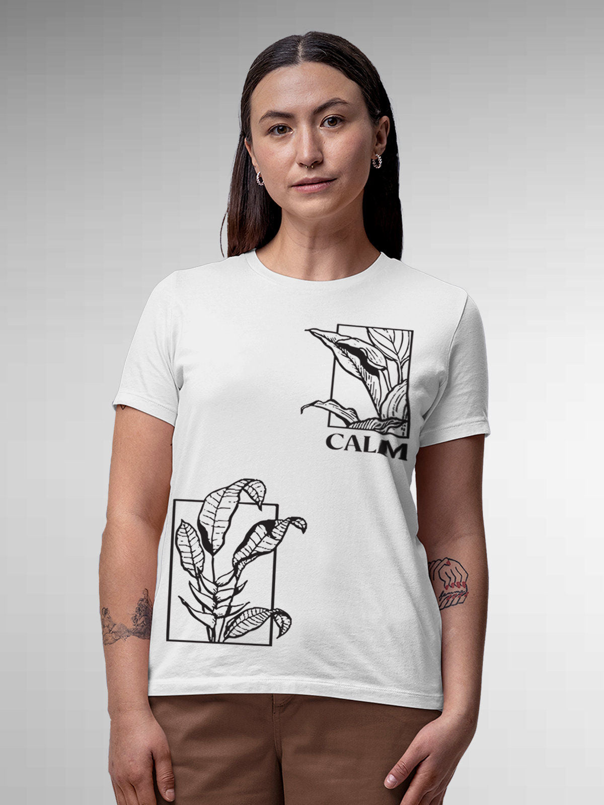 Model wearing Women's White Round Neck T-shirt with 'Calm' design, offering effortless style and premium comfort