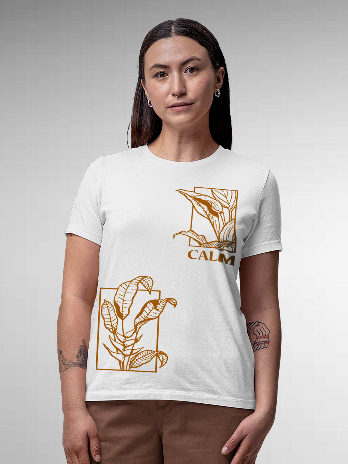 Model wearing Women's White Round Neck T-shirt with 'Calm' design, offering effortless style and premium comfort