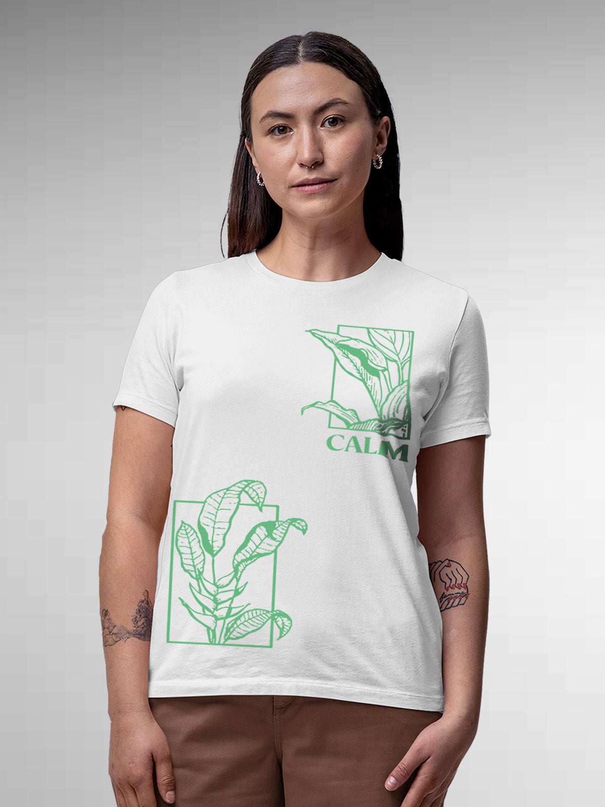 Model wearing Women's White Round Neck T-shirt with 'Calm' design, offering effortless style and premium comfort