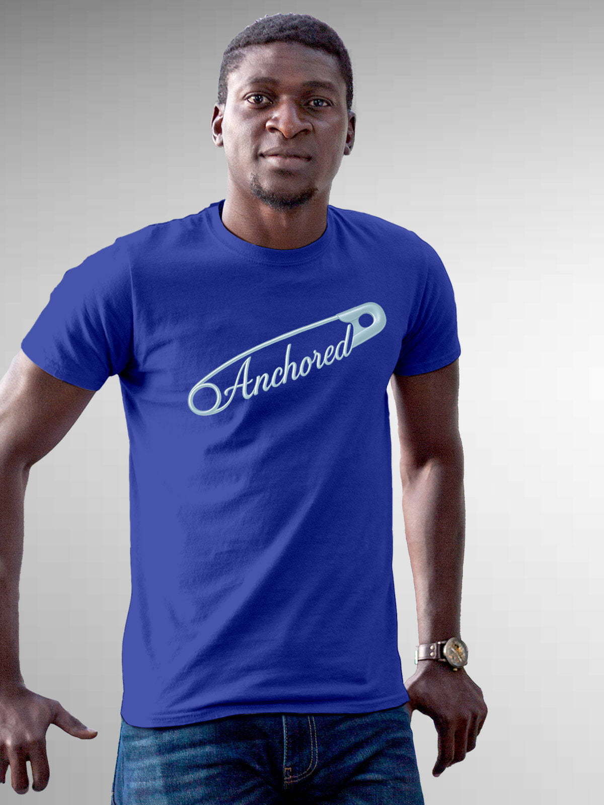 Model wearing Men's Blue Round Neck T-shirt with 'Anchored' design, offering effortless style and premium comfort